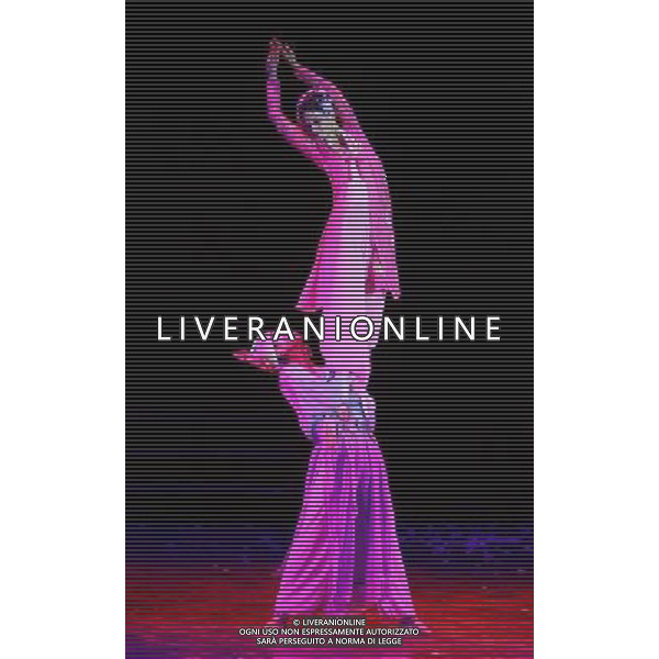 CHENGDU - NOVEMBER 26: Dancers Xu Peng and Hu Qinxin (top) perform during the drama Peony Pavilion in Chengdu of southwest China\'s Sichuan province Wednesday, Nov. 26, 2008. The drama Peony Pavilion, a 16th-century tale of love, death and resurrection written by Tang Xianzu (1550-1616), has served as inspiration for a number of artists from all kind of genres, from Kunqu Opera to drama and ballet. Choreographed by Ying Zhiqi, Lu Ling and Wu Ning, this four-act full-length dance revolves around the love between Du Liniang (played by Hu Qinxin) and Liu Mengmei (played by Xu Peng), a love that extends over three lifetimes.(Photo By Qin Wang/ColorChinaPhoto) - AG. ALDO LIVERANI SAS ITALY ONLY