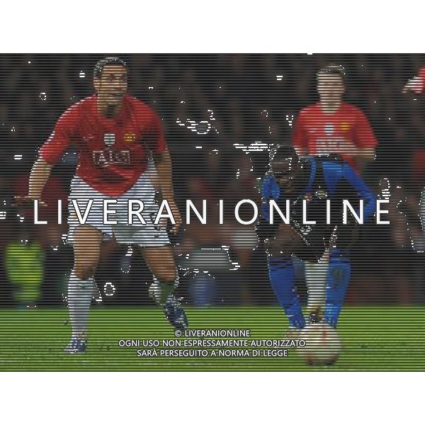 Champions League 2008/2009 Ottavi di Finale - Ritorno Manchester - 11.03.2009 Manchester United-Inter Nella Foto:BALOTELLI MARIO-FERDINAND RIO /Ph.Vitez-Ag. Aldo Liverani