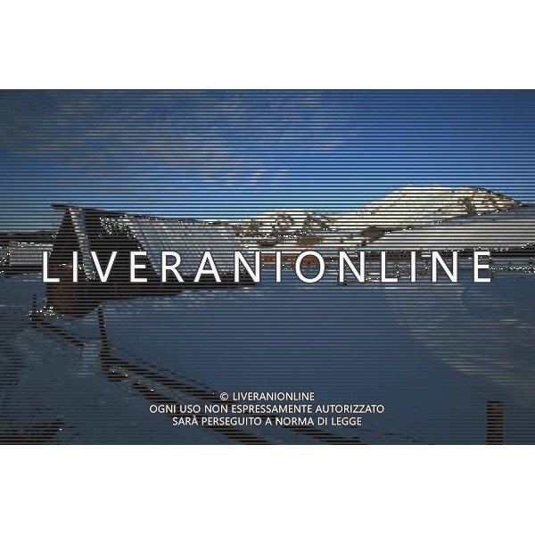 KANAS - MARCH 6: A view of the snow-covered frame houses in Hemu village at the Kanas nature reserve in Xinjiang Uygur Autonomous Region, China on Friday, March 6, 2009. Sharing borders with Kazakhstan, Russia and Mongolia, Kanas Nature Reserve boasts a beautiful natural ecosystem formed by lakes, rivers, glaciers, forests, and grasslands. Hemu Village, ranked by China National Geography as one of the six most beautiful villages in China, is one of the three residences of the Tuva Mongol in the country. The Tuva Mongol of Hemu Village lives in frame houses half-buried in the ground to resist the chillness of winter. They believe in Buddhism and have well preserved the traditional beliefs of their tribe.(Photo By Zhou You/ColorChinaPhoto) - AG. ALDO LIVERANI SAS ITALY ONLY