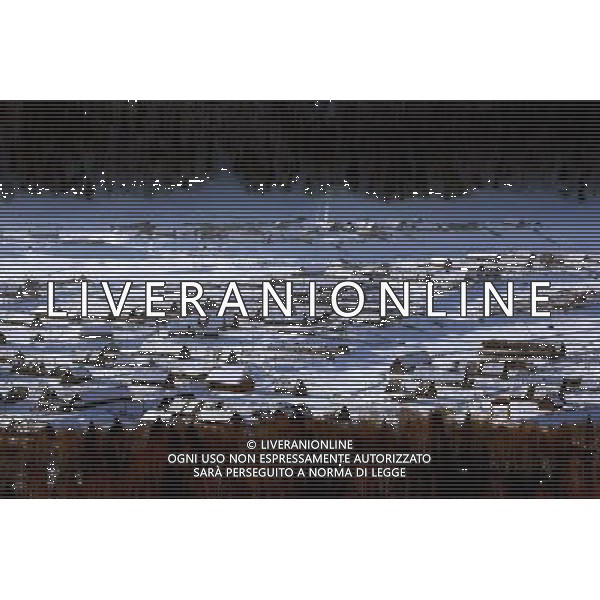 KANAS - MARCH 6: A view of the snow-covered frame houses in Hemu village at the Kanas nature reserve in Xinjiang Uygur Autonomous Region, China on Friday, March 6, 2009. Sharing borders with Kazakhstan, Russia and Mongolia, Kanas Nature Reserve boasts a beautiful natural ecosystem formed by lakes, rivers, glaciers, forests, and grasslands. Hemu Village, ranked by China National Geography as one of the six most beautiful villages in China, is one of the three residences of the Tuva Mongol in the country. The Tuva Mongol of Hemu Village lives in frame houses half-buried in the ground to resist the chillness of winter. They believe in Buddhism and have well preserved the traditional beliefs of their tribe.(Photo By Zhou You/ColorChinaPhoto) - AG. ALDO LIVERANI SAS ITALY ONLY