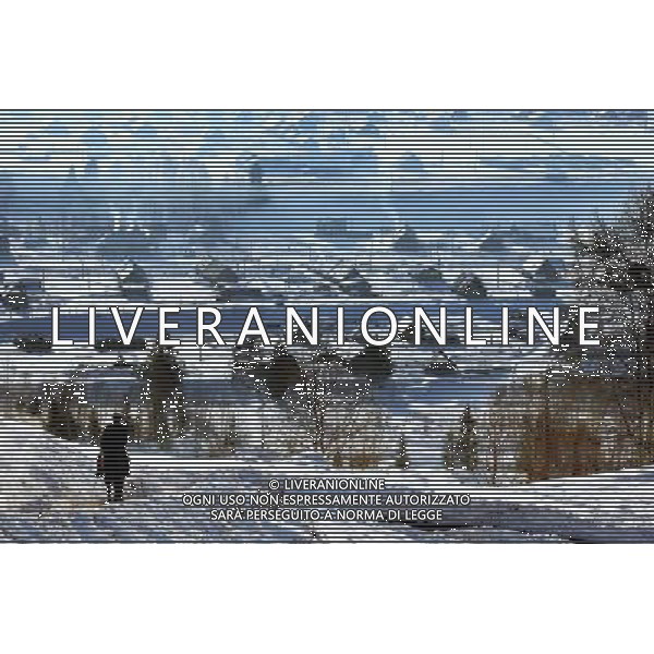 KANAS - MARCH 6: A view of the snow-covered frame houses in Hemu village at the Kanas nature reserve in Xinjiang Uygur Autonomous Region, China on Friday, March 6, 2009. Sharing borders with Kazakhstan, Russia and Mongolia, Kanas Nature Reserve boasts a beautiful natural ecosystem formed by lakes, rivers, glaciers, forests, and grasslands. Hemu Village, ranked by China National Geography as one of the six most beautiful villages in China, is one of the three residences of the Tuva Mongol in the country. The Tuva Mongol of Hemu Village lives in frame houses half-buried in the ground to resist the chillness of winter. They believe in Buddhism and have well preserved the traditional beliefs of their tribe.(Photo By Zhou You/ColorChinaPhoto) - AG. ALDO LIVERANI SAS ITALY ONLY