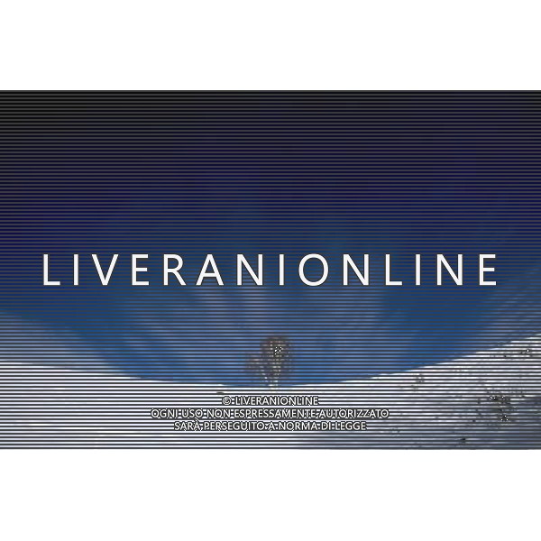 KANAS - MARCH 6: A view of the snow-covered mountain in Hemu village at the Kanas nature reserve in Xinjiang Uygur Autonomous Region, China on Friday, March 6, 2009. Sharing borders with Kazakhstan, Russia and Mongolia, Kanas Nature Reserve boasts a beautiful natural ecosystem formed by lakes, rivers, glaciers, forests, and grasslands. Hemu Village, ranked by China National Geography as one of the six most beautiful villages in China, is one of the three residences of the Tuva Mongol in the country. The Tuva Mongol of Hemu Village lives in frame houses half-buried in the ground to resist the chillness of winter. They believe in Buddhism and have well preserved the traditional beliefs of their tribe.(Photo By Zhou You/ColorChinaPhoto) - AG. ALDO LIVERANI SAS ITALY ONLY