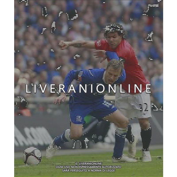 Manchester United\'s Carlos Tevez with Everton\'s Phil Neville. Everton v Manchester United, FA Cup Semi Final, Wembley Stadium 19/04/09. ph ag. aldo liverani sas only italy 