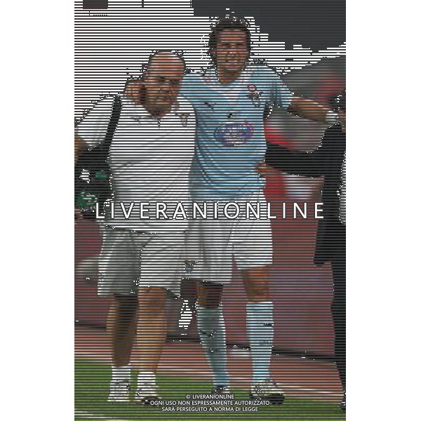 Lazio\'s Stefano Mauri (R) injures during the Italian Super Cup against Inter at the National Stadium, also known as Bird\'s Nest, in Beijing, China on Saturday, Aug. 8, 2009. Lazio won the match 2-1.(Photo By Qiu Feng/ColorChinaPhoto) Inter - lazio Supercoppa Italiana a Pechino 08/08/2009 - Stefano Mauri Infortunato /Agenzia Aldo Liverani Sas - ITALY ONLY -