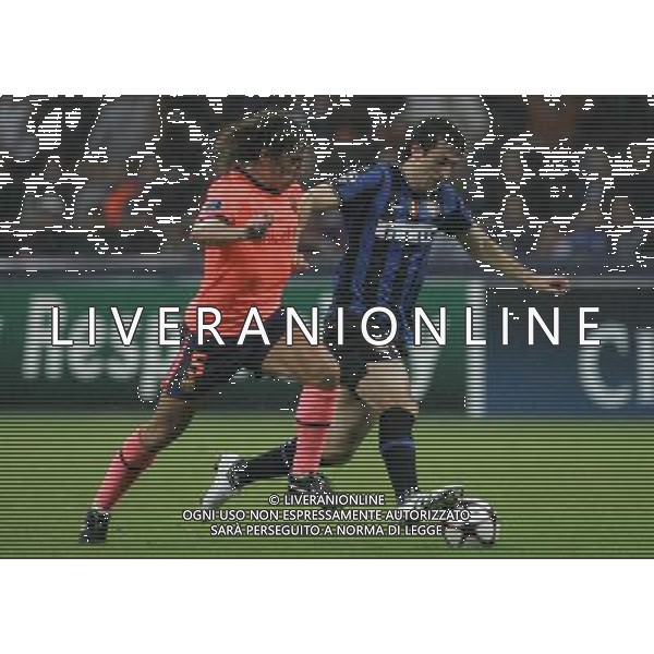 Milano 16-09-2009 Champions League 2009/10 Gruppo F Inter-Barcellona 0:0 nella foto diego alberto milito e carles puyol ph marco luzzani/ag aldo liverani s.a.s. 