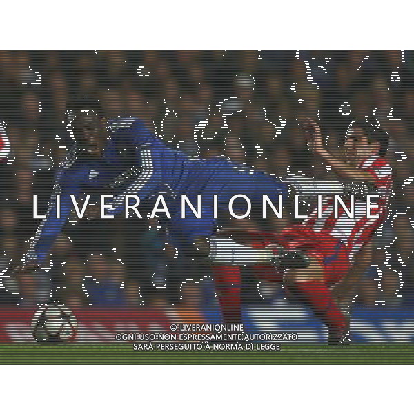 Michael Essien of Chelsea goes down hard under a challenge from Raul Garcia of Atletico Madrid ,Chelsea v Athletico Madrid, UEFA Champions League, Stamford Bridge, London, Date 21/10/2009 Picture by Marc Atkins(IPS PHOTO AGENCY)/Agenzia Aldo Liverani Sas - ITALY ONLY -