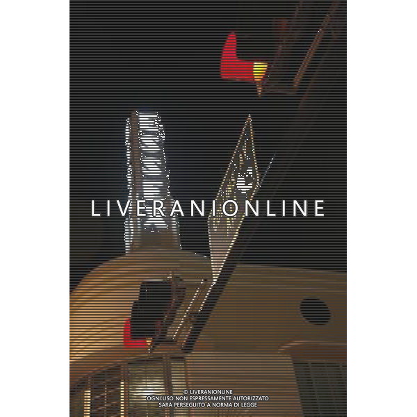 Night scene of the lights of the Essex Hotel in the art deco district on Collins Avenue with red traffic light on Miami Beach, America /Agenzia Aldo Liverani Sas - ITALY ONLY -