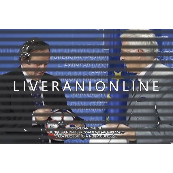 European parliament President , Polish, Jerzy Buzek and UEFA soccer organization, President Michel Platini (L) sign balls after their meeting at EU Parliament in Brussels, Belgium on 2009-11-05 Michel Platini, the head of the Union of European Football Associations, is pleading with European officials for an American-style system that restricts spending to a percentage of every soccer teams revenues. © by Wiktor Dabkowski /Agenzia Aldo Liverani Sas - ITALY ONLY -