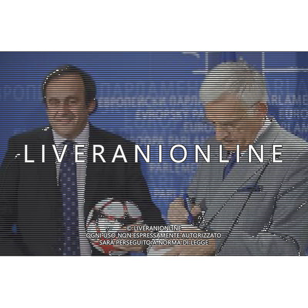 European parliament President , Polish, Jerzy Buzek and UEFA soccer organization, President Michel Platini (L) sign balls after their meeting at EU Parliament in Brussels, Belgium on 2009-11-05 Michel Platini, the head of the Union of European Football Associations, is pleading with European officials for an American-style system that restricts spending to a percentage of every soccer teams revenues. © by Wiktor Dabkowski /Agenzia Aldo Liverani Sas - ITALY ONLY -
