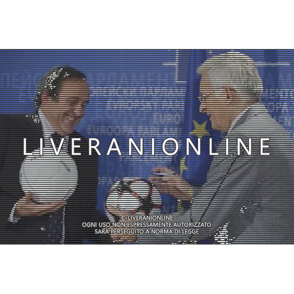 European parliament President , Polish, Jerzy Buzek and UEFA soccer organization, President Michel Platini (L) sign balls after their meeting at EU Parliament in Brussels, Belgium on 2009-11-05 Michel Platini, the head of the Union of European Football Associations, is pleading with European officials for an American-style system that restricts spending to a percentage of every soccer teams revenues. © by Wiktor Dabkowski /Agenzia Aldo Liverani Sas - ITALY ONLY -
