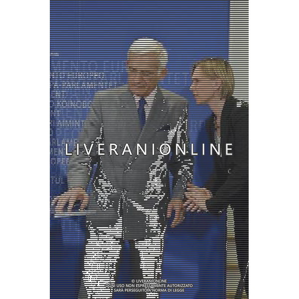European parliament President , Polish, Jerzy Buzek chat with his spokeperson Inga Rosinska as he holds a press conference after meetingwith UEFA soccer organization, President Michel Platini (not in the picture) at EU Parliament in Brussels, Belgium on 2009-11-05 Michel Platini, the head of the Union of European Football Associations, is pleading with European officials for an American-style system that restricts spending to a percentage of every soccer teams revenues. © by Wiktor Dabkowski /Agenzia Aldo Liverani Sas - ITALY ONLY -