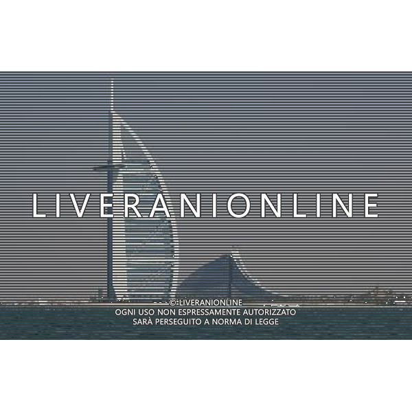 The 321 meters high Burj Al Arab (l) in form of a sail, \' with; seven Sternen\' one of the luxurišsesten hotels of the world, and the Jumeirah Beach hotel, which is to remind of a sea wave, in the city Dubai at Persian Gulf in the emirate Dubai of the united Arab emirates. (Admission of 19.11.2008). At no other place of the world 21 developed in the first years. Century so many world-wide attention exciting buildings. Nearly all projects are carried by private investors. © PHOTOSHOT - AG. ALDO LIVERANI SAS ITALY ONLY DUBAI - EMIRATI ARABI