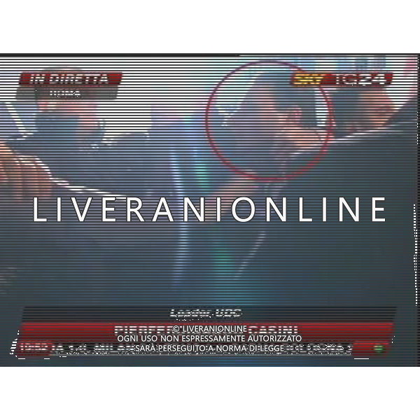 Aggressione al Presidente del Consiglio Silvio Berlusconi alla fine del suo comizio in Piazza Duomo a Milano 13/12/2009 nella foto l\'aggressore Massimo Tartaglia fermato dalle forze dell\'ordine obbligatorio citare la fonte televisiva (SkyTg24) Agenzia Aldo Liverani Sas 