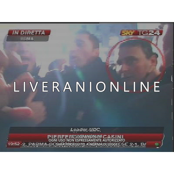 Aggressione al Presidente del Consiglio Silvio Berlusconi alla fine del suo comizio in Piazza Duomo a Milano 13/12/2009 nella foto l\'aggressore Massimo Tartaglia fermato dalle forze dell\'ordine obbligatorio citare la fonte televisiva (SkyTg24) Agenzia Aldo Liverani Sas 