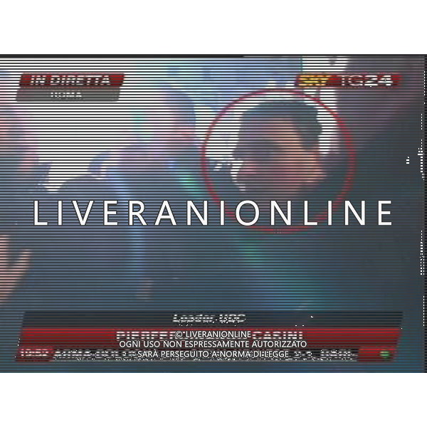 Aggressione al Presidente del Consiglio Silvio Berlusconi alla fine del suo comizio in Piazza Duomo a Milano 13/12/2009 nella foto l\'aggressore Massimo Tartaglia fermato dalle forze dell\'ordine obbligatorio citare la fonte televisiva (SkyTg24) Agenzia Aldo Liverani Sas 