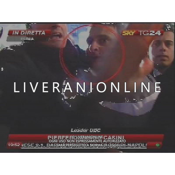 Aggressione al Presidente del Consiglio Silvio Berlusconi alla fine del suo comizio in Piazza Duomo a Milano 13/12/2009 nella foto l\'aggressore Massimo Tartaglia fermato dalle forze dell\'ordine obbligatorio citare la fonte televisiva (SkyTg24) Agenzia Aldo Liverani Sas 