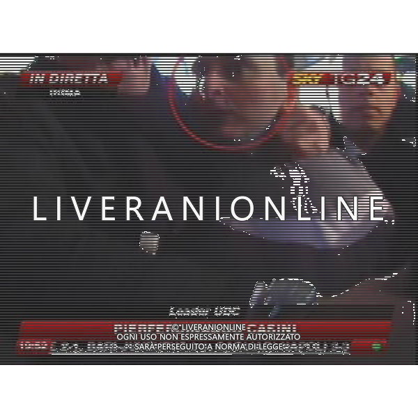 Aggressione al Presidente del Consiglio Silvio Berlusconi alla fine del suo comizio in Piazza Duomo a Milano 13/12/2009 nella foto l\'aggressore Massimo Tartaglia fermato dalle forze dell\'ordine obbligatorio citare la fonte televisiva (SkyTg24) Agenzia Aldo Liverani Sas 