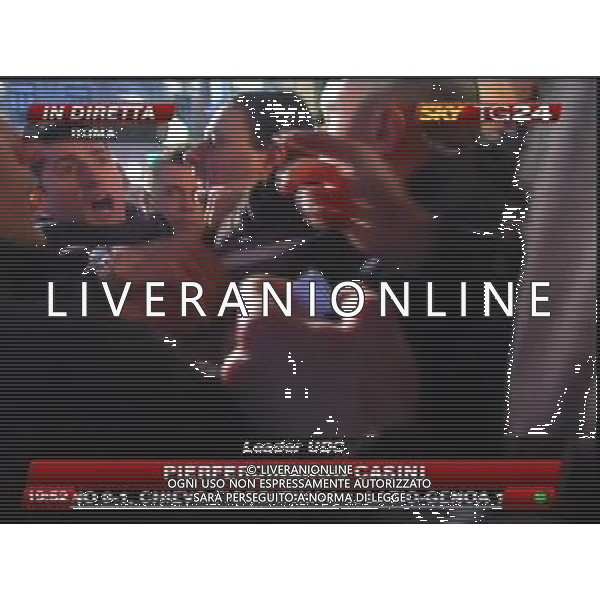 Aggressione al Presidente del Consiglio Silvio Berlusconi alla fine del suo comizio in Piazza Duomo a Milano 13/12/2009 nella foto l\'aggressore Massimo Tartaglia fermato dalle forze dell\'ordine obbligatorio citare la fonte televisiva (SkyTg24) Agenzia Aldo Liverani Sas 