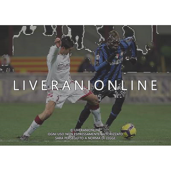 Inter - Livorno Coppa Italia Tim Cup 16/12/2009 nella foto mario balotelli e perticone ©Luzzani/Agenzia Aldo Liverani Sas