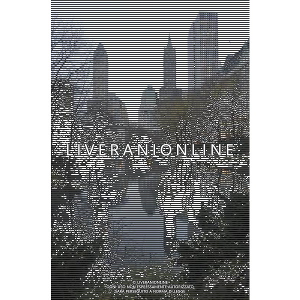 Central Park in New York City at Dusk Facing East with the Pond in the foreground and Fifthth Avenue buildings looming in the background. Date: 12/14/09. Photo Credit: Dan D\'Errico - Photoshot - Ag. Aldo Liverani sas ITALY ONLY