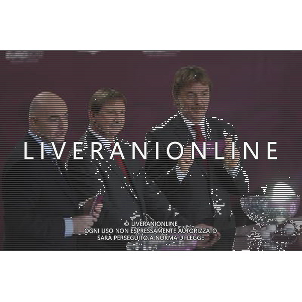 Polish former football star Zbigniew Boniek (R) draws Spain next UEFA general secretary Gianni Infantino (L) and Polish former football star Andrzej Szarmach (C) durnig the UEFA EURO 2012 qualifying Draw Cremony in the Congress Hall of the Palace of Culture and Science in Warsaw, Poland, 7 February 2010. 51 teams taking part in the Euro 2012 qualifications will create nine groups. Six of them will consist of six teams, and three of them – five. Winners and one team from the second place with the best achievements will advance to championships directly. The other eight teams classified on the second position in the group will set up four pairs. The EURO 2012 European soccer championship will kick off June 2012 in Poland and Ukraine. The opening match at the National Stadium in Warsaw will take place on 8 June. Eliminations will begin in September 2010 and will last until autumn 2011. /Agenzia Aldo Liverani Sas - ITALY ONLY - VARSAVIA: SORTEGGI DI QUALIFICAZIONE AGLI EUROPEI DI CALCIO UCRAINA-POLONIA 2012