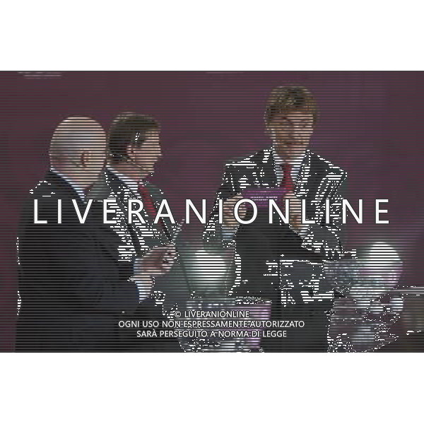 Polish former football star Zbigniew Boniek (R) draws England next UEFA general secretary Gianni Infantino (L) and Polish former football star Andrzej Szarmach (C) durnig the UEFA EURO 2012 qualifying Draw Cremony in the Congress Hall of the Palace of Culture and Science in Warsaw, Poland, 7 February 2010. 51 teams taking part in the Euro 2012 qualifications will create nine groups. Six of them will consist of six teams, and three of them – five. Winners and one team from the second place with the best achievements will advance to championships directly. The other eight teams classified on the second position in the group will set up four pairs. The EURO 2012 European soccer championship will kick off June 2012 in Poland and Ukraine. The opening match at the National Stadium in Warsaw will take place on 8 June. Eliminations will begin in September 2010 and will last until autumn 2011. /Agenzia Aldo Liverani Sas - ITALY ONLY - VARSAVIA: SORTEGGI DI QUALIFICAZIONE AGLI EUROPEI DI CALCIO UCRAINA-POLONIA 2012