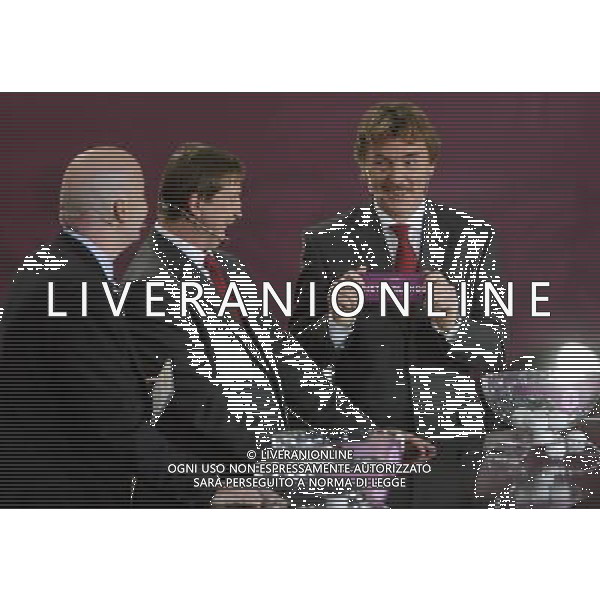 Polish former football star Zbigniew Boniek (R) draws Netherlands next UEFA general secretary Gianni Infantino (L) and Polish former football star Andrzej Szarmach (C) durnig the UEFA EURO 2012 qualifying Draw Cremony in the Congress Hall of the Palace of Culture and Science in Warsaw, Poland, 7 February 2010. 51 teams taking part in the Euro 2012 qualifications will create nine groups. Six of them will consist of six teams, and three of them – five. Winners and one team from the second place with the best achievements will advance to championships directly. The other eight teams classified on the second position in the group will set up four pairs. The EURO 2012 European soccer championship will kick off June 2012 in Poland and Ukraine. The opening match at the National Stadium in Warsaw will take place on 8 June. Eliminations will begin in September 2010 and will last until autumn 2011. /Agenzia Aldo Liverani Sas - ITALY ONLY - VARSAVIA: SORTEGGI DI QUALIFICAZIONE AGLI EUROPEI DI CALCIO UCRAINA-POLONIA 2012