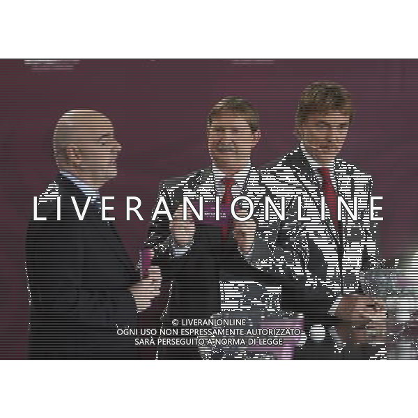 Polish former football star Andrzej Szarmach (C) draws Croatia next UEFA general secretary Gianni Infantino (L) and Polish former football star Zbigniew Boniek durnig the UEFA EURO 2012 qualifying Draw Cremony in the Congress Hall of the Palace of Culture and Science in Warsaw, Poland, 7 February 2010. 51 teams taking part in the Euro 2012 qualifications will create nine groups. Six of them will consist of six teams, and three of them – five. Winners and one team from the second place with the best achievements will advance to championships directly. The other eight teams classified on the second position in the group will set up four pairs. The EURO 2012 European soccer championship will kick off June 2012 in Poland and Ukraine. The opening match at the National Stadium in Warsaw will take place on 8 June. Eliminations will begin in September 2010 and will last until autumn 2011. /Agenzia Aldo Liverani Sas - ITALY ONLY - VARSAVIA: SORTEGGI DI QUALIFICAZIONE AGLI EUROPEI DI CALCIO UCRAINA-POLONIA 2012