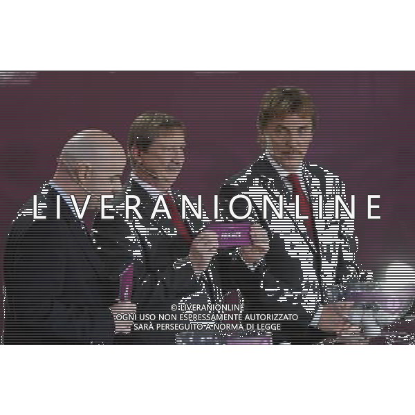 Polish former football star Andrzej Szarmach (C) draws France next UEFA general secretary Gianni Infantino (L) and Polish former football star Zbigniew Boniek durnig the UEFA EURO 2012 qualifying Draw Cremony in the Congress Hall of the Palace of Culture and Science in Warsaw, Poland, 7 February 2010. 51 teams taking part in the Euro 2012 qualifications will create nine groups. Six of them will consist of six teams, and three of them – five. Winners and one team from the second place with the best achievements will advance to championships directly. The other eight teams classified on the second position in the group will set up four pairs. The EURO 2012 European soccer championship will kick off June 2012 in Poland and Ukraine. The opening match at the National Stadium in Warsaw will take place on 8 June. Eliminations will begin in September 2010 and will last until autumn 2011. /Agenzia Aldo Liverani Sas - ITALY ONLY - VARSAVIA: SORTEGGI DI QUALIFICAZIONE AGLI EUROPEI DI CALCIO UCRAINA-POLONIA 2012