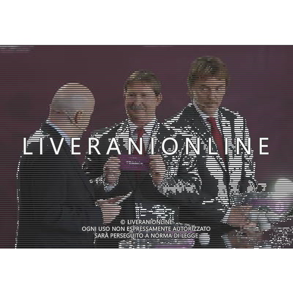 Polish former football star Andrzej Szarmach (C) draws France next UEFA general secretary Gianni Infantino (L) and Polish former football star Zbigniew Boniek durnig the UEFA EURO 2012 qualifying Draw Cremony in the Congress Hall of the Palace of Culture and Science in Warsaw, Poland, 7 February 2010. 51 teams taking part in the Euro 2012 qualifications will create nine groups. Six of them will consist of six teams, and three of them – five. Winners and one team from the second place with the best achievements will advance to championships directly. The other eight teams classified on the second position in the group will set up four pairs. The EURO 2012 European soccer championship will kick off June 2012 in Poland and Ukraine. The opening match at the National Stadium in Warsaw will take place on 8 June. Eliminations will begin in September 2010 and will last until autumn 2011. /Agenzia Aldo Liverani Sas - ITALY ONLY - VARSAVIA: SORTEGGI DI QUALIFICAZIONE AGLI EUROPEI DI CALCIO UCRAINA-POLONIA 2012