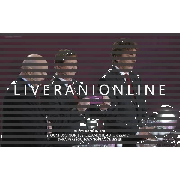 Polish former football star Andrzej Szarmach (C) draws Russia next UEFA general secretary Gianni Infantino (L) and Polish former football star Zbigniew Boniek durnig the UEFA EURO 2012 qualifying Draw Cremony in the Congress Hall of the Palace of Culture and Science in Warsaw, Poland, 7 February 2010. 51 teams taking part in the Euro 2012 qualifications will create nine groups. Six of them will consist of six teams, and three of them – five. Winners and one team from the second place with the best achievements will advance to championships directly. The other eight teams classified on the second position in the group will set up four pairs. The EURO 2012 European soccer championship will kick off June 2012 in Poland and Ukraine. The opening match at the National Stadium in Warsaw will take place on 8 June. Eliminations will begin in September 2010 and will last until autumn 2011. /Agenzia Aldo Liverani Sas - ITALY ONLY - VARSAVIA: SORTEGGI DI QUALIFICAZIONE AGLI EUROPEI DI CALCIO UCRAINA-POLONIA 2012