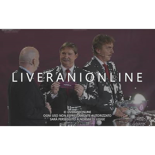 Polish former football star Andrzej Szarmach (C) draws Russia next UEFA general secretary Gianni Infantino (L) and Polish former football star Zbigniew Boniek durnig the UEFA EURO 2012 qualifying Draw Cremony in the Congress Hall of the Palace of Culture and Science in Warsaw, Poland, 7 February 2010. 51 teams taking part in the Euro 2012 qualifications will create nine groups. Six of them will consist of six teams, and three of them – five. Winners and one team from the second place with the best achievements will advance to championships directly. The other eight teams classified on the second position in the group will set up four pairs. The EURO 2012 European soccer championship will kick off June 2012 in Poland and Ukraine. The opening match at the National Stadium in Warsaw will take place on 8 June. Eliminations will begin in September 2010 and will last until autumn 2011. /Agenzia Aldo Liverani Sas - ITALY ONLY - VARSAVIA: SORTEGGI DI QUALIFICAZIONE AGLI EUROPEI DI CALCIO UCRAINA-POLONIA 2012