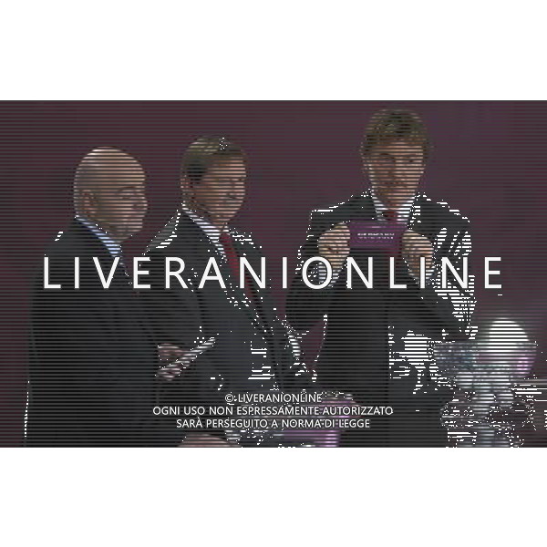 Polish former football star Zbigniew Boniek (R) draws Germany next UEFA general secretary Gianni Infantino (L) and Polish former football star Andrzej Szarmach (C) durnig the UEFA EURO 2012 qualifying Draw Cremony in the Congress Hall of the Palace of Culture and Science in Warsaw, Poland, 7 February 2010. 51 teams taking part in the Euro 2012 qualifications will create nine groups. Six of them will consist of six teams, and three of them – five. Winners and one team from the second place with the best achievements will advance to championships directly. The other eight teams classified on the second position in the group will set up four pairs. The EURO 2012 European soccer championship will kick off June 2012 in Poland and Ukraine. The opening match at the National Stadium in Warsaw will take place on 8 June. Eliminations will begin in September 2010 and will last until autumn 2011. /Agenzia Aldo Liverani Sas - ITALY ONLY - VARSAVIA: SORTEGGI DI QUALIFICAZIONE AGLI EUROPEI DI CALCIO UCRAINA-POLONIA 2012