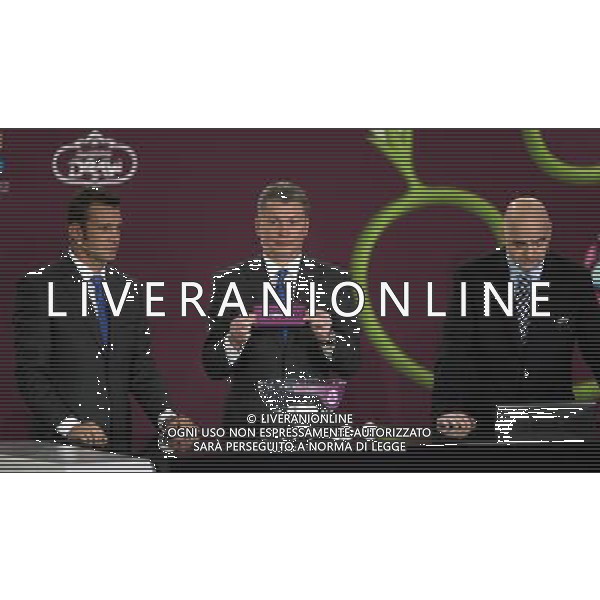 Ukrainian former football star Oleg Blokhin (C) draws Romania next the Ukrainian soccer player Andriy Shevchenko (L) with UEFA general secretary Gianni Infantino (R) durnig the UEFA EURO 2012 qualifying Draw Cremony in the Congress Hall of the Palace of Culture and Science in Warsaw, Poland, 7 February 2010. 51 teams taking part in the Euro 2012 qualifications will create nine groups. Six of them will consist of six teams, and three of them – five. Winners and one team from the second place with the best achievements will advance to championships directly. The other eight teams classified on the second position in the group will set up four pairs. The EURO 2012 European soccer championship will kick off June 2012 in Poland and Ukraine. The opening match at the National Stadium in Warsaw will take place on 8 June. Eliminations will begin in September 2010 and will last until autumn 2011. /Agenzia Aldo Liverani Sas - ITALY ONLY - VARSAVIA: SORTEGGI DI QUALIFICAZIONE AGLI EUROPEI DI CALCIO UCRAINA-POLONIA 2012