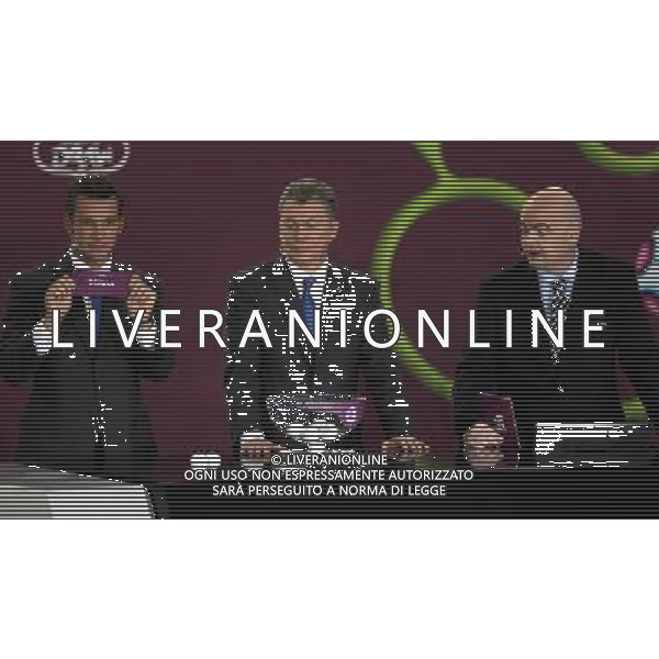 Ukrainian football star Andriy Shevchenko (L) draw Serbia next the former Ukrainian soccer player Oleg Blokhin (C) with UEFA general secretary Gianni Infantino (R) durnig the UEFA EURO 2012 qualifying Draw Cremony in the Congress Hall of the Palace of Culture and Science in Warsaw, Poland, 7 February 2010. 51 teams taking part in the Euro 2012 qualifications will create nine groups. Six of them will consist of six teams, and three of them – five. Winners and one team from the second place with the best achievements will advance to championships directly. The other eight teams classified on the second position in the group will set up four pairs. The EURO 2012 European soccer championship will kick off June 2012 in Poland and Ukraine. The opening match at the National Stadium in Warsaw will take place on 8 June. Eliminations will begin in September 2010 and will last until autumn 2011. /Agenzia Aldo Liverani Sas - ITALY ONLY - VARSAVIA: SORTEGGI DI QUALIFICAZIONE AGLI EUROPEI DI CALCIO UCRAINA-POLONIA 2012