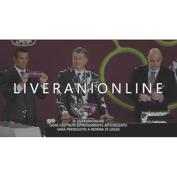 Ukrainian football star Andriy Shevchenko (L) draw Switzerland next the former Ukrainian soccer player Oleg Blokhin (C) with UEFA general secretary Gianni Infantino (R) durnig the UEFA EURO 2012 qualifying Draw Cremony in the Congress Hall of the Palace of Culture and Science in Warsaw, Poland, 7 February 2010. 51 teams taking part in the Euro 2012 qualifications will create nine groups. Six of them will consist of six teams, and three of them – five. Winners and one team from the second place with the best achievements will advance to championships directly. The other eight teams classified on the second position in the group will set up four pairs. The EURO 2012 European soccer championship will kick off June 2012 in Poland and Ukraine. The opening match at the National Stadium in Warsaw will take place on 8 June. Eliminations will begin in September 2010 and will last until autumn 2011. /Agenzia Aldo Liverani Sas - ITALY ONLY - VARSAVIA: SORTEGGI DI QUALIFICAZIONE AGLI EUROPEI DI CALCIO UCRAINA-POLONIA 2012