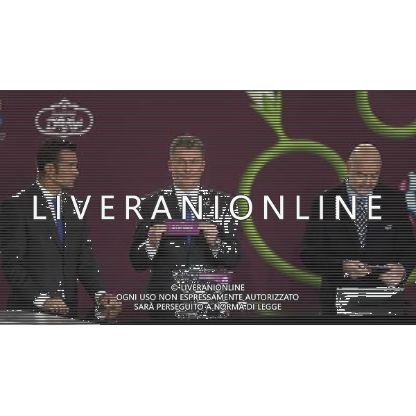 Ukrainian former football star Oleg Blokhin (C) draws Denmark next the Ukrainian soccer player Andriy Shevchenko (L) with UEFA general secretary Gianni Infantino (R) durnig the UEFA EURO 2012 qualifying Draw Cremony in the Congress Hall of the Palace of Culture and Science in Warsaw, Poland, 7 February 2010. 51 teams taking part in the Euro 2012 qualifications will create nine groups. Six of them will consist of six teams, and three of them – five. Winners and one team from the second place with the best achievements will advance to championships directly. The other eight teams classified on the second position in the group will set up four pairs. The EURO 2012 European soccer championship will kick off June 2012 in Poland and Ukraine. The opening match at the National Stadium in Warsaw will take place on 8 June. Eliminations will begin in September 2010 and will last until autumn 2011. /Agenzia Aldo Liverani Sas - ITALY ONLY - VARSAVIA: SORTEGGI DI QUALIFICAZIONE AGLI EUROPEI DI CALCIO UCRAINA-POLONIA 2012