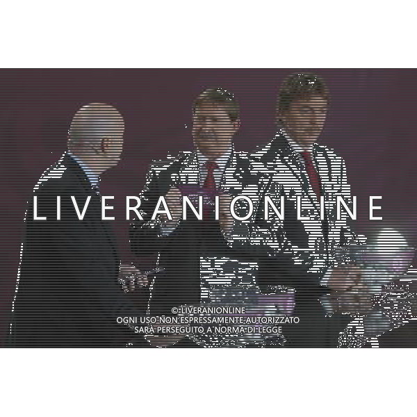 Polish former football star Andrzej Szarmach (C) draws Bosnia-Herzegovina next UEFA general secretary Gianni Infantino (L) and Polish former football star Zbigniew Boniek durnig the UEFA EURO 2012 qualifying Draw Cremony in the Congress Hall of the Palace of Culture and Science in Warsaw, Poland, 7 February 2010. 51 teams taking part in the Euro 2012 qualifications will create nine groups. Six of them will consist of six teams, and three of them – five. Winners and one team from the second place with the best achievements will advance to championships directly. The other eight teams classified on the second position in the group will set up four pairs. The EURO 2012 European soccer championship will kick off June 2012 in Poland and Ukraine. The opening match at the National Stadium in Warsaw will take place on 8 June. Eliminations will begin in September 2010 and will last until autumn 2011. /Agenzia Aldo Liverani Sas - ITALY ONLY - VARSAVIA: SORTEGGI DI QUALIFICAZIONE AGLI EUROPEI DI CALCIO UCRAINA-POLONIA 2012