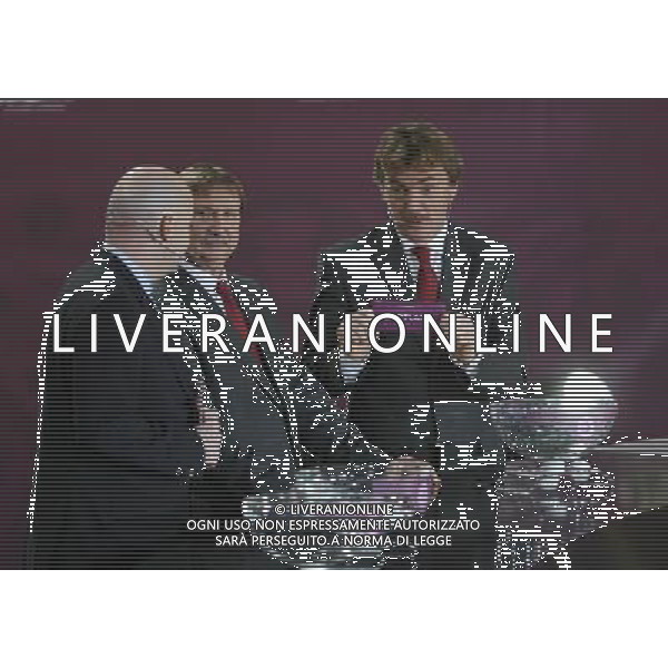 Polish former football star Zbigniew Boniek (R) draws Scotland next UEFA general secretary Gianni Infantino (L) and Polish former football star Andrzej Szarmach (C) durnig the UEFA EURO 2012 qualifying Draw Cremony in the Congress Hall of the Palace of Culture and Science in Warsaw, Poland, 7 February 2010. 51 teams taking part in the Euro 2012 qualifications will create nine groups. Six of them will consist of six teams, and three of them – five. Winners and one team from the second place with the best achievements will advance to championships directly. The other eight teams classified on the second position in the group will set up four pairs. The EURO 2012 European soccer championship will kick off June 2012 in Poland and Ukraine. The opening match at the National Stadium in Warsaw will take place on 8 June. Eliminations will begin in September 2010 and will last until autumn 2011. /Agenzia Aldo Liverani Sas - ITALY ONLY - VARSAVIA: SORTEGGI DI QUALIFICAZIONE AGLI EUROPEI DI CALCIO UCRAINA-POLONIA 2012