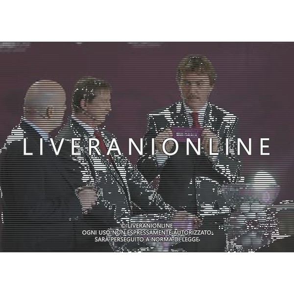 Polish former football star Zbigniew Boniek (R) draws Bulgaria next UEFA general secretary Gianni Infantino (L) and Polish former football star Andrzej Szarmach (C) durnig the UEFA EURO 2012 qualifying Draw Cremony in the Congress Hall of the Palace of Culture and Science in Warsaw, Poland, 7 February 2010. 51 teams taking part in the Euro 2012 qualifications will create nine groups. Six of them will consist of six teams, and three of them – five. Winners and one team from the second place with the best achievements will advance to championships directly. The other eight teams classified on the second position in the group will set up four pairs. The EURO 2012 European soccer championship will kick off June 2012 in Poland and Ukraine. The opening match at the National Stadium in Warsaw will take place on 8 June. Eliminations will begin in September 2010 and will last until autumn 2011. /Agenzia Aldo Liverani Sas - ITALY ONLY - VARSAVIA: SORTEGGI DI QUALIFICAZIONE AGLI EUROPEI DI CALCIO UCRAINA-POLONIA 2012