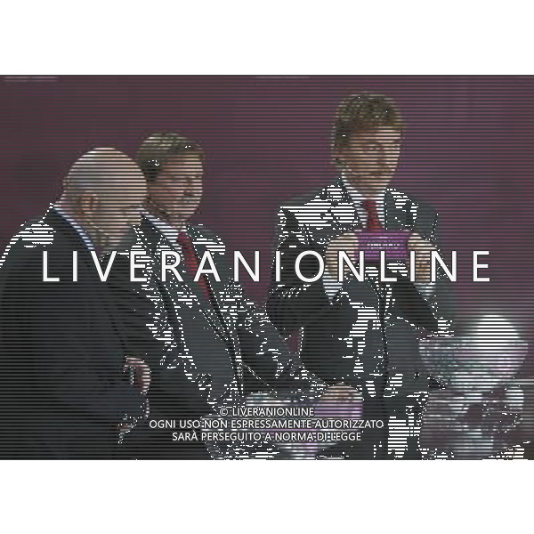 Polish former football star Zbigniew Boniek (R) draws Finland next UEFA general secretary Gianni Infantino (L) and Polish former football star Andrzej Szarmach (C) durnig the UEFA EURO 2012 qualifying Draw Cremony in the Congress Hall of the Palace of Culture and Science in Warsaw, Poland, 7 February 2010. 51 teams taking part in the Euro 2012 qualifications will create nine groups. Six of them will consist of six teams, and three of them – five. Winners and one team from the second place with the best achievements will advance to championships directly. The other eight teams classified on the second position in the group will set up four pairs. The EURO 2012 European soccer championship will kick off June 2012 in Poland and Ukraine. The opening match at the National Stadium in Warsaw will take place on 8 June. Eliminations will begin in September 2010 and will last until autumn 2011. /Agenzia Aldo Liverani Sas - ITALY ONLY - VARSAVIA: SORTEGGI DI QUALIFICAZIONE AGLI EUROPEI DI CALCIO UCRAINA-POLONIA 2012