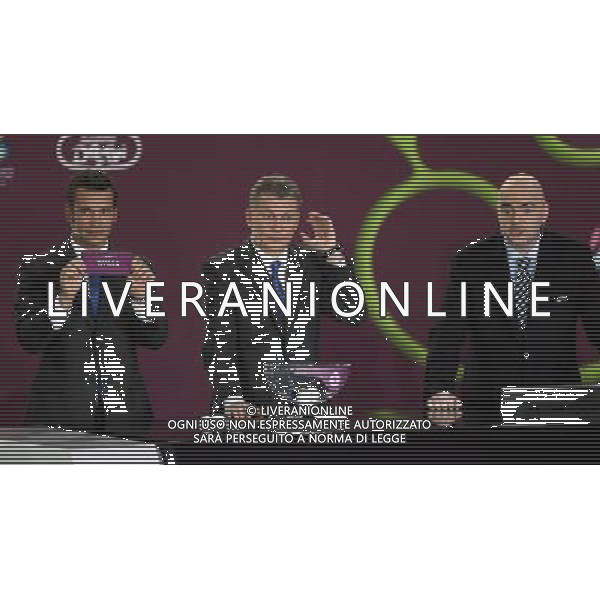 Ukrainian football star Andriy Shevchenko (L) draw Wales next the former Ukrainian soccer player Oleg Blokhin (C) with UEFA general secretary Gianni Infantino (R) durnig the UEFA EURO 2012 qualifying Draw Cremony in the Congress Hall of the Palace of Culture and Science in Warsaw, Poland, 7 February 2010. 51 teams taking part in the Euro 2012 qualifications will create nine groups. Six of them will consist of six teams, and three of them – five. Winners and one team from the second place with the best achievements will advance to championships directly. The other eight teams classified on the second position in the group will set up four pairs. The EURO 2012 European soccer championship will kick off June 2012 in Poland and Ukraine. The opening match at the National Stadium in Warsaw will take place on 8 June. Eliminations will begin in September 2010 and will last until autumn 2011. /Agenzia Aldo Liverani Sas - ITALY ONLY - VARSAVIA: SORTEGGI DI QUALIFICAZIONE AGLI EUROPEI DI CALCIO UCRAINA-POLONIA 2012