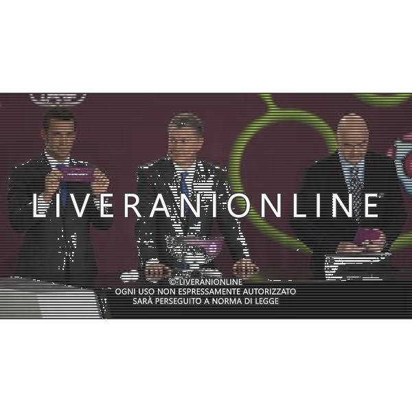 Ukrainian football star Andriy Shevchenko (L) draw Hungary next the former Ukrainian soccer player Oleg Blokhin (C) with UEFA general secretary Gianni Infantino (R) durnig the UEFA EURO 2012 qualifying Draw Cremony in the Congress Hall of the Palace of Culture and Science in Warsaw, Poland, 7 February 2010. 51 teams taking part in the Euro 2012 qualifications will create nine groups. Six of them will consist of six teams, and three of them – five. Winners and one team from the second place with the best achievements will advance to championships directly. The other eight teams classified on the second position in the group will set up four pairs. The EURO 2012 European soccer championship will kick off June 2012 in Poland and Ukraine. The opening match at the National Stadium in Warsaw will take place on 8 June. Eliminations will begin in September 2010 and will last until autumn 2011. /Agenzia Aldo Liverani Sas - ITALY ONLY - VARSAVIA: SORTEGGI DI QUALIFICAZIONE AGLI EUROPEI DI CALCIO UCRAINA-POLONIA 2012