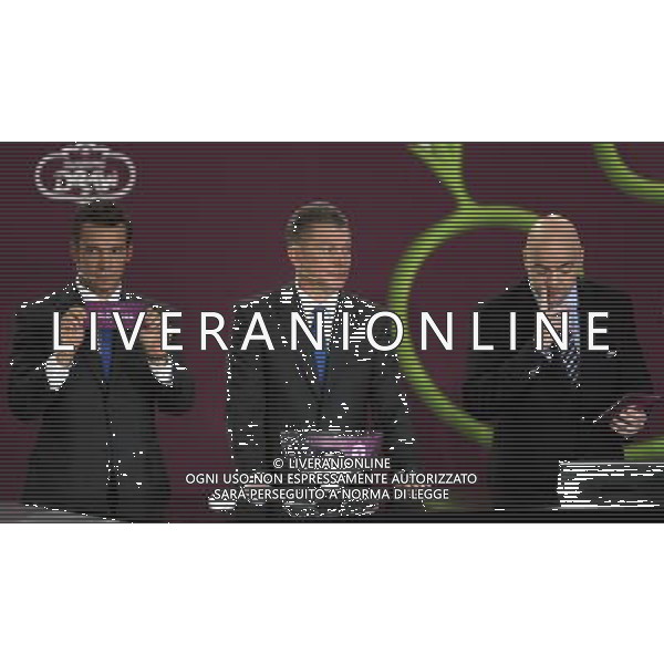 Ukrainian football star Andriy Shevchenko (L) draw Slovenia next the former Ukrainian soccer player Oleg Blokhin (C) with UEFA general secretary Gianni Infantino (R) durnig the UEFA EURO 2012 qualifying Draw Cremony in the Congress Hall of the Palace of Culture and Science in Warsaw, Poland, 7 February 2010. 51 teams taking part in the Euro 2012 qualifications will create nine groups. Six of them will consist of six teams, and three of them – five. Winners and one team from the second place with the best achievements will advance to championships directly. The other eight teams classified on the second position in the group will set up four pairs. The EURO 2012 European soccer championship will kick off June 2012 in Poland and Ukraine. The opening match at the National Stadium in Warsaw will take place on 8 June. Eliminations will begin in September 2010 and will last until autumn 2011. /Agenzia Aldo Liverani Sas - ITALY ONLY - VARSAVIA: SORTEGGI DI QUALIFICAZIONE AGLI EUROPEI DI CALCIO UCRAINA-POLONIA 2012