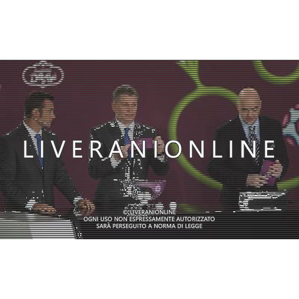 Ukrainian former football star Oleg Blokhin (C) draws Latvia next the Ukrainian soccer player Andriy Shevchenko (L) with UEFA general secretary Gianni Infantino (R) durnig the UEFA EURO 2012 qualifying Draw Cremony in the Congress Hall of the Palace of Culture and Science in Warsaw, Poland, 7 February 2010. 51 teams taking part in the Euro 2012 qualifications will create nine groups. Six of them will consist of six teams, and three of them – five. Winners and one team from the second place with the best achievements will advance to championships directly. The other eight teams classified on the second position in the group will set up four pairs. The EURO 2012 European soccer championship will kick off June 2012 in Poland and Ukraine. The opening match at the National Stadium in Warsaw will take place on 8 June. Eliminations will begin in September 2010 and will last until autumn 2011. /Agenzia Aldo Liverani Sas - ITALY ONLY - VARSAVIA: SORTEGGI DI QUALIFICAZIONE AGLI EUROPEI DI CALCIO UCRAINA-POLONIA 2012