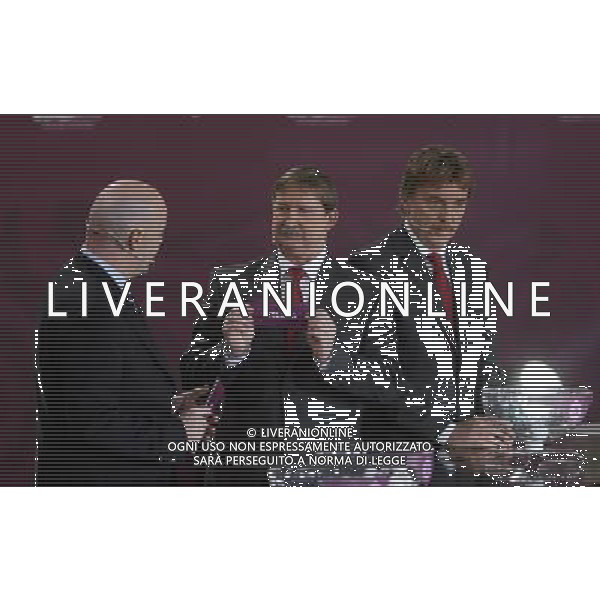 Polish former football star Andrzej Szarmach (C) draws Iceland next UEFA general secretary Gianni Infantino (L) and Polish former football star Zbigniew Boniek durnig the UEFA EURO 2012 qualifying Draw Cremony in the Congress Hall of the Palace of Culture and Science in Warsaw, Poland, 7 February 2010. 51 teams taking part in the Euro 2012 qualifications will create nine groups. Six of them will consist of six teams, and three of them – five. Winners and one team from the second place with the best achievements will advance to championships directly. The other eight teams classified on the second position in the group will set up four pairs. The EURO 2012 European soccer championship will kick off June 2012 in Poland and Ukraine. The opening match at the National Stadium in Warsaw will take place on 8 June. Eliminations will begin in September 2010 and will last until autumn 2011. /Agenzia Aldo Liverani Sas - ITALY ONLY - VARSAVIA: SORTEGGI DI QUALIFICAZIONE AGLI EUROPEI DI CALCIO UCRAINA-POLONIA 2012