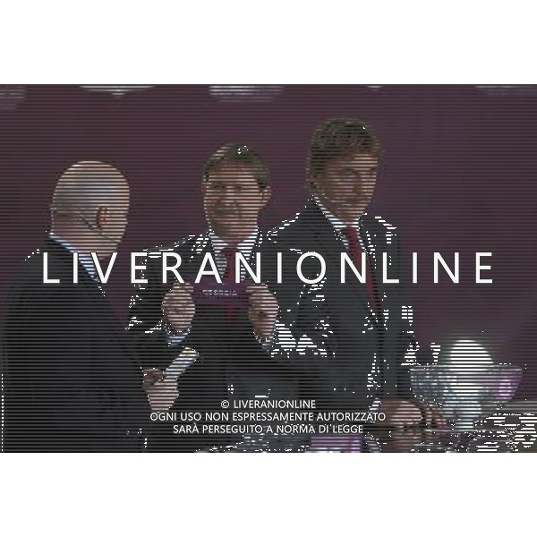 Polish former football star Andrzej Szarmach (C) draws Georgia next UEFA general secretary Gianni Infantino (L) and Polish former football star Zbigniew Boniek durnig the UEFA EURO 2012 qualifying Draw Cremony in the Congress Hall of the Palace of Culture and Science in Warsaw, Poland, 7 February 2010. 51 teams taking part in the Euro 2012 qualifications will create nine groups. Six of them will consist of six teams, and three of them – five. Winners and one team from the second place with the best achievements will advance to championships directly. The other eight teams classified on the second position in the group will set up four pairs. The EURO 2012 European soccer championship will kick off June 2012 in Poland and Ukraine. The opening match at the National Stadium in Warsaw will take place on 8 June. Eliminations will begin in September 2010 and will last until autumn 2011. /Agenzia Aldo Liverani Sas - ITALY ONLY - VARSAVIA: SORTEGGI DI QUALIFICAZIONE AGLI EUROPEI DI CALCIO UCRAINA-POLONIA 2012