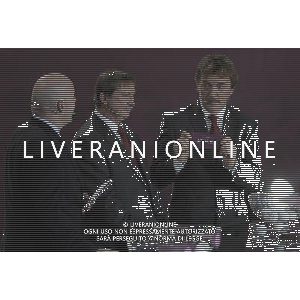 Polish former football star Zbigniew Boniek (R) draws Armenia next UEFA general secretary Gianni Infantino (L) and Polish former football star Andrzej Szarmach (C) durnig the UEFA EURO 2012 qualifying Draw Cremony in the Congress Hall of the Palace of Culture and Science in Warsaw, Poland, 7 February 2010. 51 teams taking part in the Euro 2012 qualifications will create nine groups. Six of them will consist of six teams, and three of them – five. Winners and one team from the second place with the best achievements will advance to championships directly. The other eight teams classified on the second position in the group will set up four pairs. The EURO 2012 European soccer championship will kick off June 2012 in Poland and Ukraine. The opening match at the National Stadium in Warsaw will take place on 8 June. Eliminations will begin in September 2010 and will last until autumn 2011. /Agenzia Aldo Liverani Sas - ITALY ONLY - VARSAVIA: SORTEGGI DI QUALIFICAZIONE AGLI EUROPEI DI CALCIO UCRAINA-POLONIA 2012