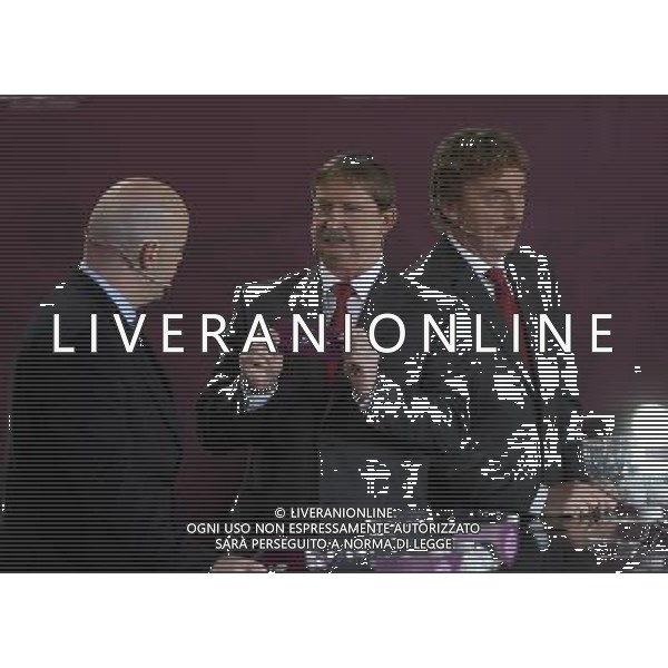 Polish former football star Andrzej Szarmach (C) draws Albania next UEFA general secretary Gianni Infantino (L) and Polish former football star Zbigniew Boniek durnig the UEFA EURO 2012 qualifying Draw Cremony in the Congress Hall of the Palace of Culture and Science in Warsaw, Poland, 7 February 2010. 51 teams taking part in the Euro 2012 qualifications will create nine groups. Six of them will consist of six teams, and three of them – five. Winners and one team from the second place with the best achievements will advance to championships directly. The other eight teams classified on the second position in the group will set up four pairs. The EURO 2012 European soccer championship will kick off June 2012 in Poland and Ukraine. The opening match at the National Stadium in Warsaw will take place on 8 June. Eliminations will begin in September 2010 and will last until autumn 2011. /Agenzia Aldo Liverani Sas - ITALY ONLY - VARSAVIA: SORTEGGI DI QUALIFICAZIONE AGLI EUROPEI DI CALCIO UCRAINA-POLONIA 2012