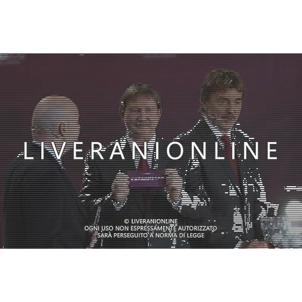 Polish former football star Andrzej Szarmach (C) draws Kazakhstan next UEFA general secretary Gianni Infantino (L) and Polish former football star Zbigniew Boniek durnig the UEFA EURO 2012 qualifying Draw Cremony in the Congress Hall of the Palace of Culture and Science in Warsaw, Poland, 7 February 2010. 51 teams taking part in the Euro 2012 qualifications will create nine groups. Six of them will consist of six teams, and three of them – five. Winners and one team from the second place with the best achievements will advance to championships directly. The other eight teams classified on the second position in the group will set up four pairs. The EURO 2012 European soccer championship will kick off June 2012 in Poland and Ukraine. The opening match at the National Stadium in Warsaw will take place on 8 June. Eliminations will begin in September 2010 and will last until autumn 2011. /Agenzia Aldo Liverani Sas - ITALY ONLY - VARSAVIA: SORTEGGI DI QUALIFICAZIONE AGLI EUROPEI DI CALCIO UCRAINA-POLONIA 2012